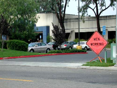 Men Working Sign